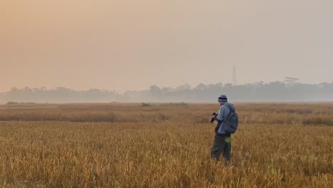 single photographer taking pictures of environment near polluting gas plant