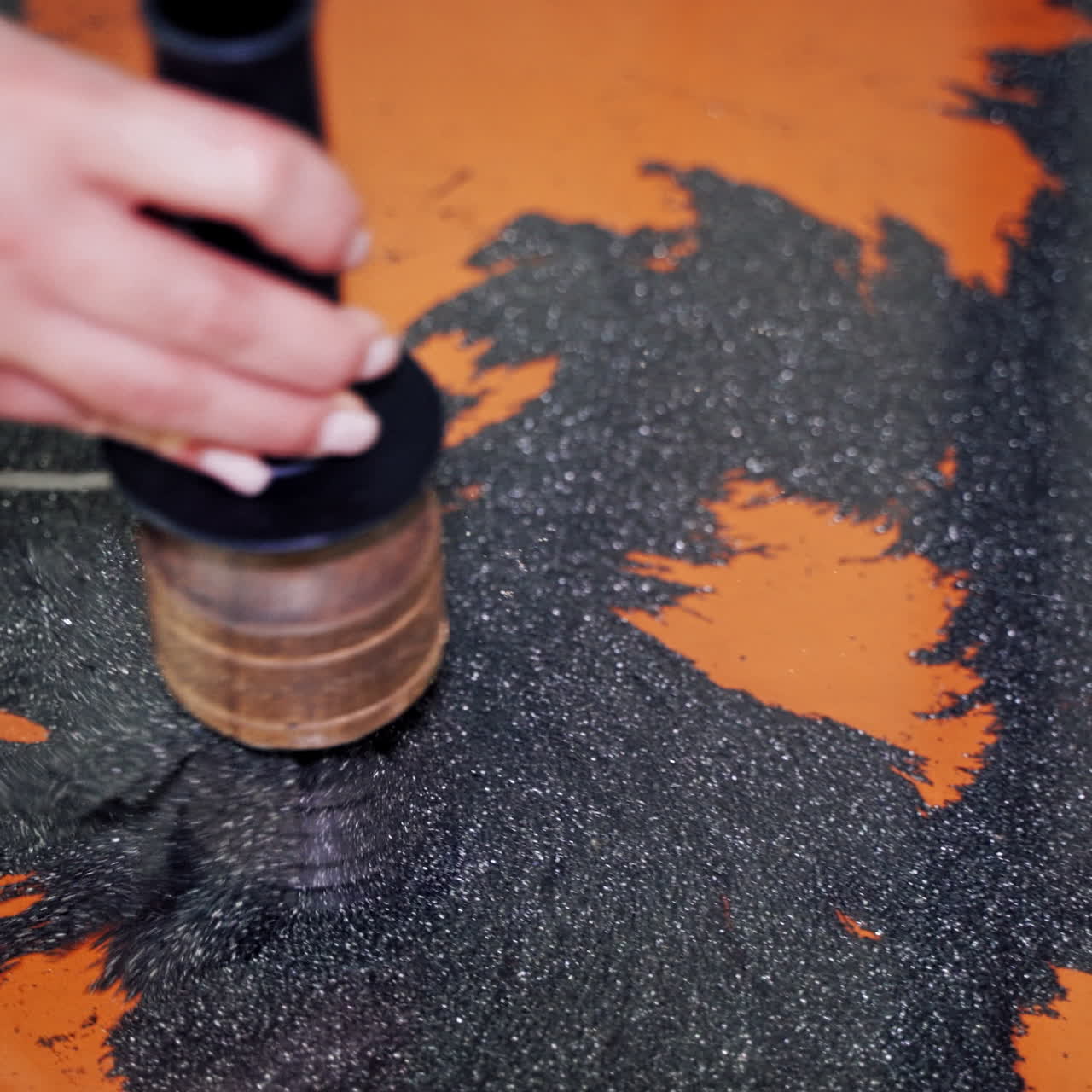 The boy at the science center. Iron powder under the influence of a magnetic field.