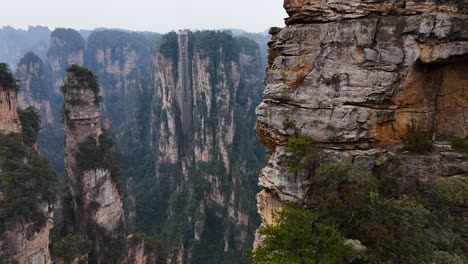 tall sandstone pillars rise above the valleys in zhangjiajie, creating a stunning natural landscape that feels surreal and awe-inspiring. inspired the floating mountains in the movie avatar.