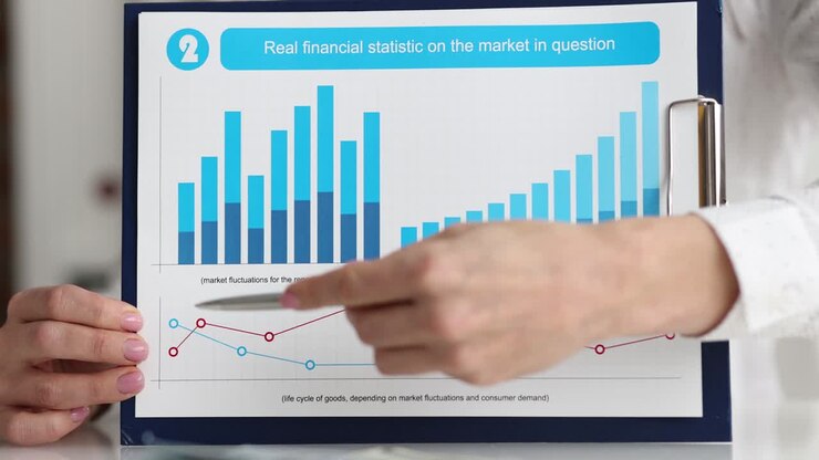 Businesswoman shows real financial statistics for market question charts closeup