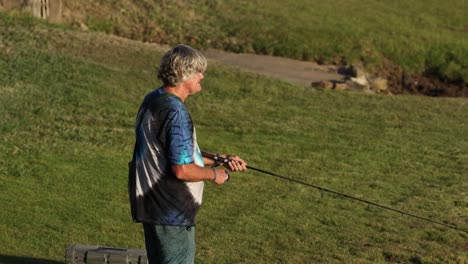 elderly gentleman enjoys leisurely fishing outdoors