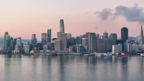 aerial track right around san francisco downtown financial district at sunrise