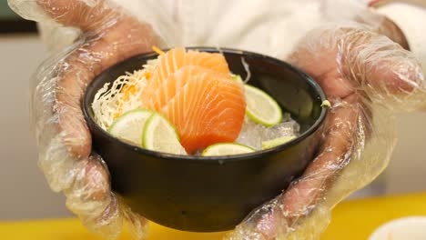 chef preparing salmon sashimi