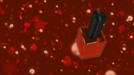 esmalte de uñas rojo contra un fondo de brillo rojo