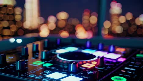 dj mixer at night with city lights