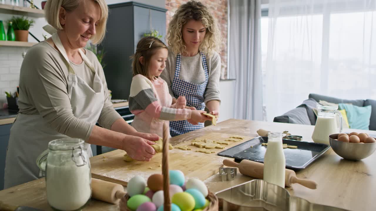 Video of women during preparing Easter cookies in the kitchen