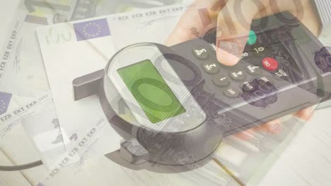 animation of euro banknotes falling over hand of caucasian man holding payment terminal