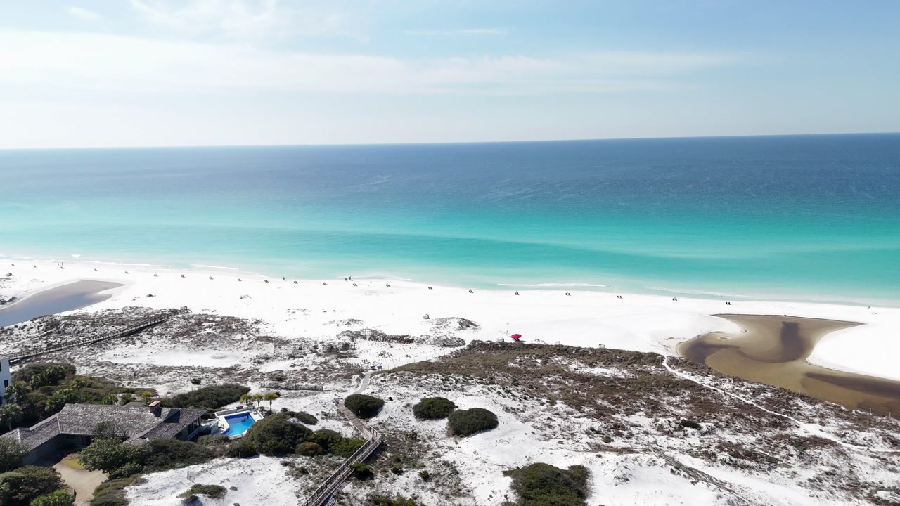 Coastal resort buildings overlooking bright turquoise Gulf and white sandy Blue Mountain Beach, Santa Rosa Beach, Florida, USA