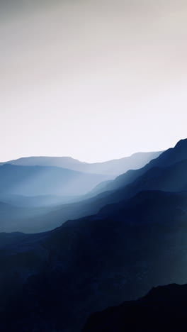 Majestic mountains bathed in soft light during early morning hours