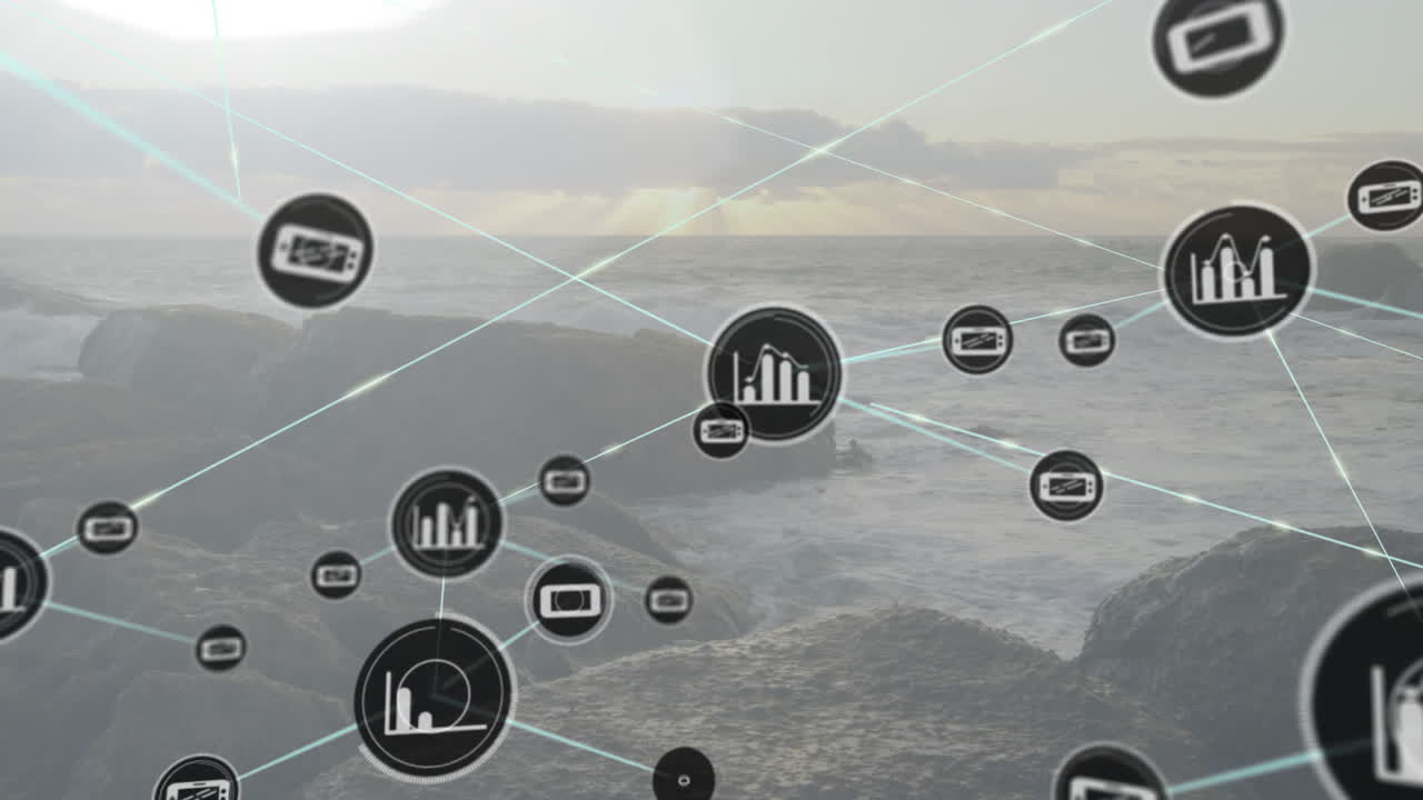 Animation of data icons and connections over ocean waves and rocky shore
