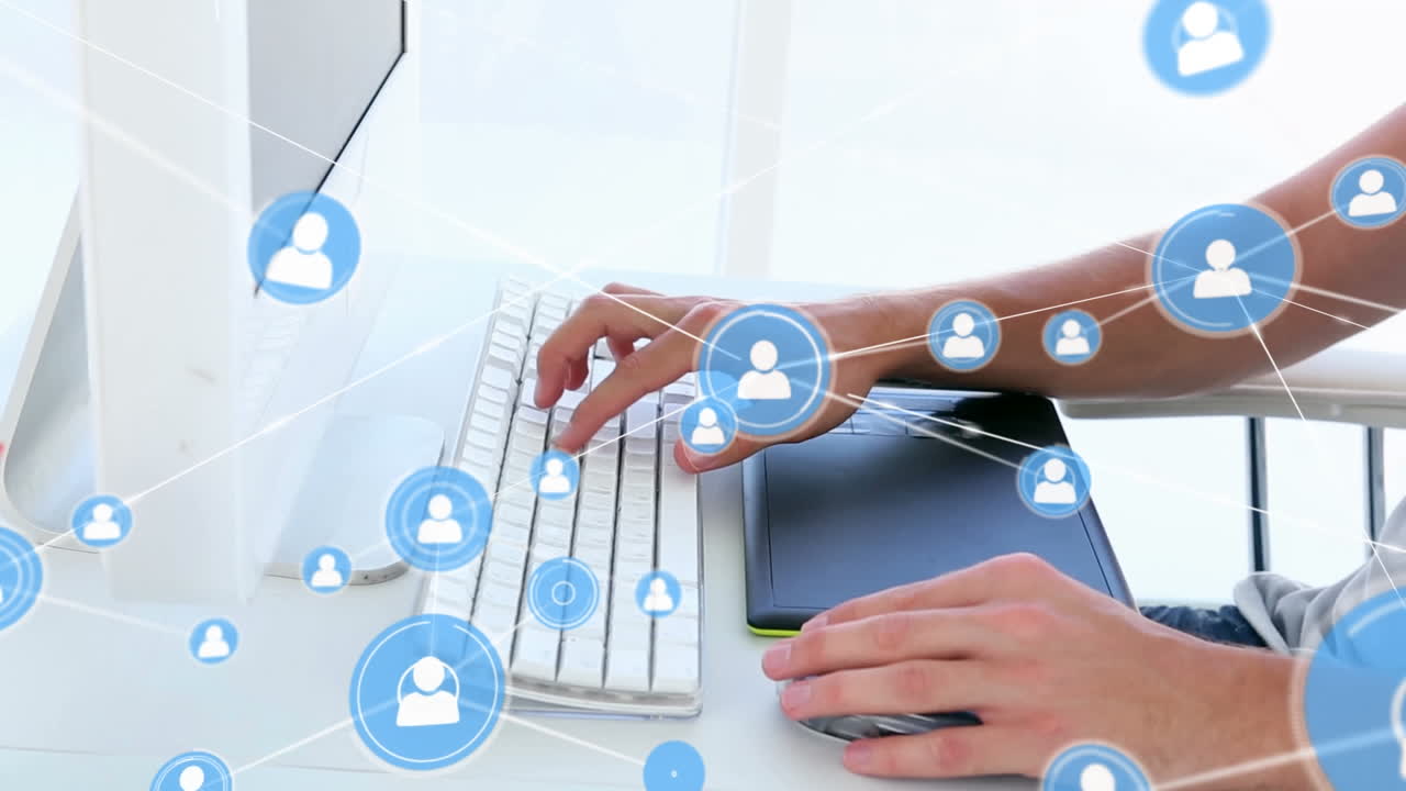 animación de iconos conectados, hombre caucásico usando tableta gráfica y escribiendo en el teclado del escritorio