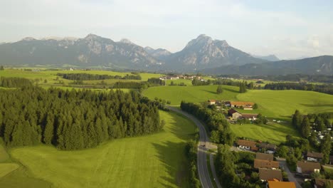 cars driving on rural winding road in europe