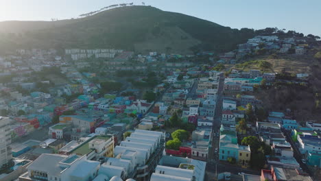 Aerial-footage-of-brightly-coloured-houses-on-slope-of-Signal-Hill-in-Bo-Kaap-residential-borough.-Cape-Town,-South-Africa