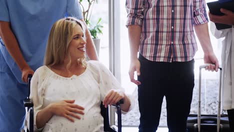 Male-doctor-interacting-with-pregnant-woman