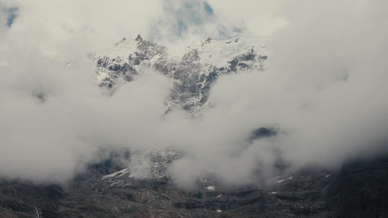 Mysterious Mountain Peaks shrouded in Clouds and Fog
