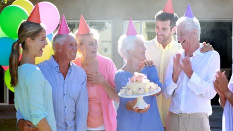 Doctors-and-senior-citizen-celebrating-birthday