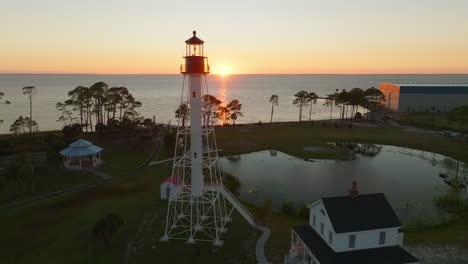 drone shot of sunset and beautiful coastal views passing by the cape san blas lighthouse in port st