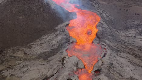 aerial of hot molten lava flowing in a river from fagradalsfjall volcano on the reykjanes peninsula in iceland