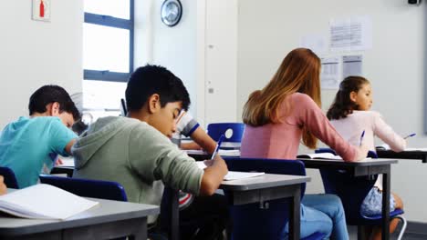 students doing homework in classroom