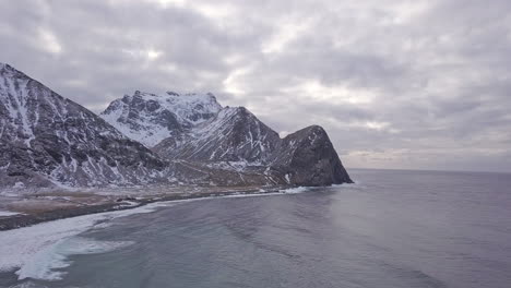 Aerial-shot-of-the-sea-at-Unstad-beach,-Lofoten-Islands,-Norway