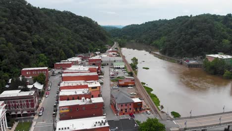 4k aerial drone video of the baileys branch bridge over the french broad river in downtown marshall, nc (2021)