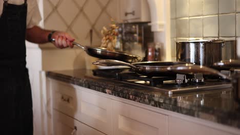 professional chef flame tossing vegetables  in high heat