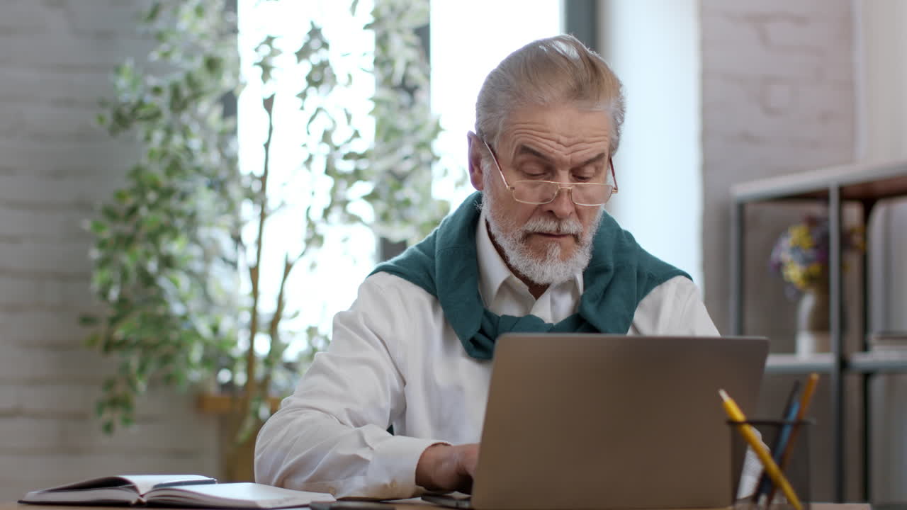 Older Man Working on Laptop
