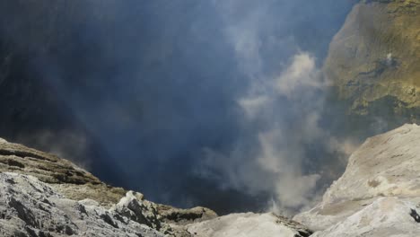 smoke rose from bromo crater the steaming active volcano, tengger semeru national park in east java, indonesia