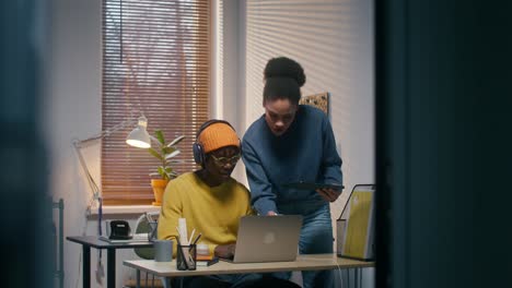 two people collaborating on a project in a home office