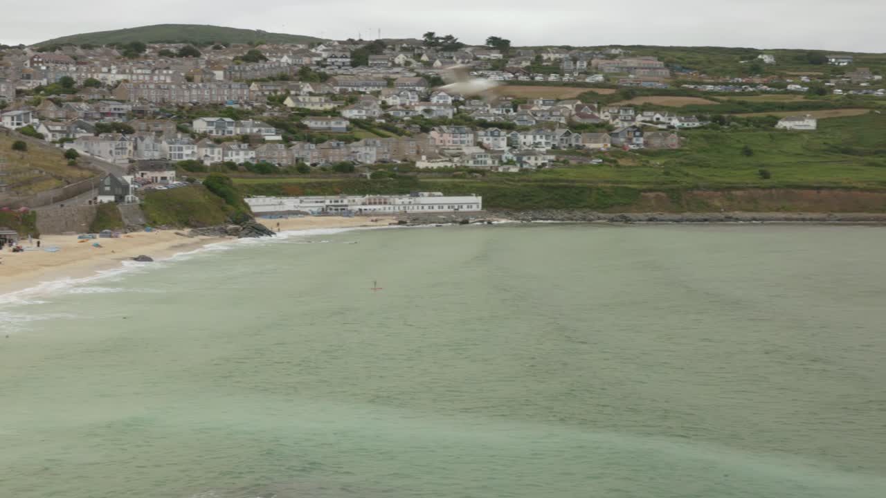 Telephoto shot of the golden sand Porthmeor Beach in St Ives