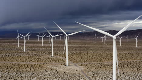 drone shot of eolic park on a stormy day in the wastelands of southwestern usa