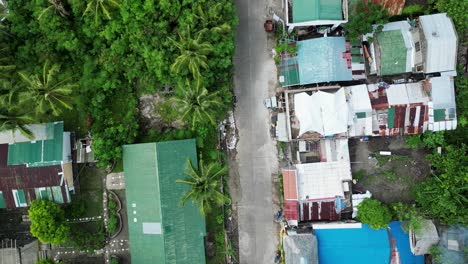 flying above typical houses in rural village in the province of catanduanes in the philippines