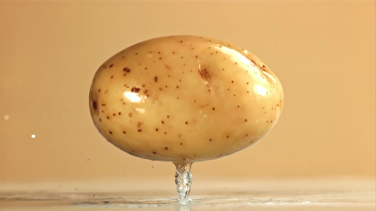 Slow Motion of a Potato Dropping and Splashing Water