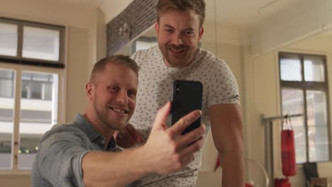 Caucasian-male-couple-in-social-distancing-at-home