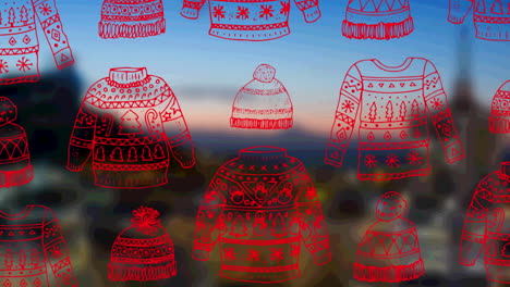 animation of christmas sweatshirts and hats over cityscape background