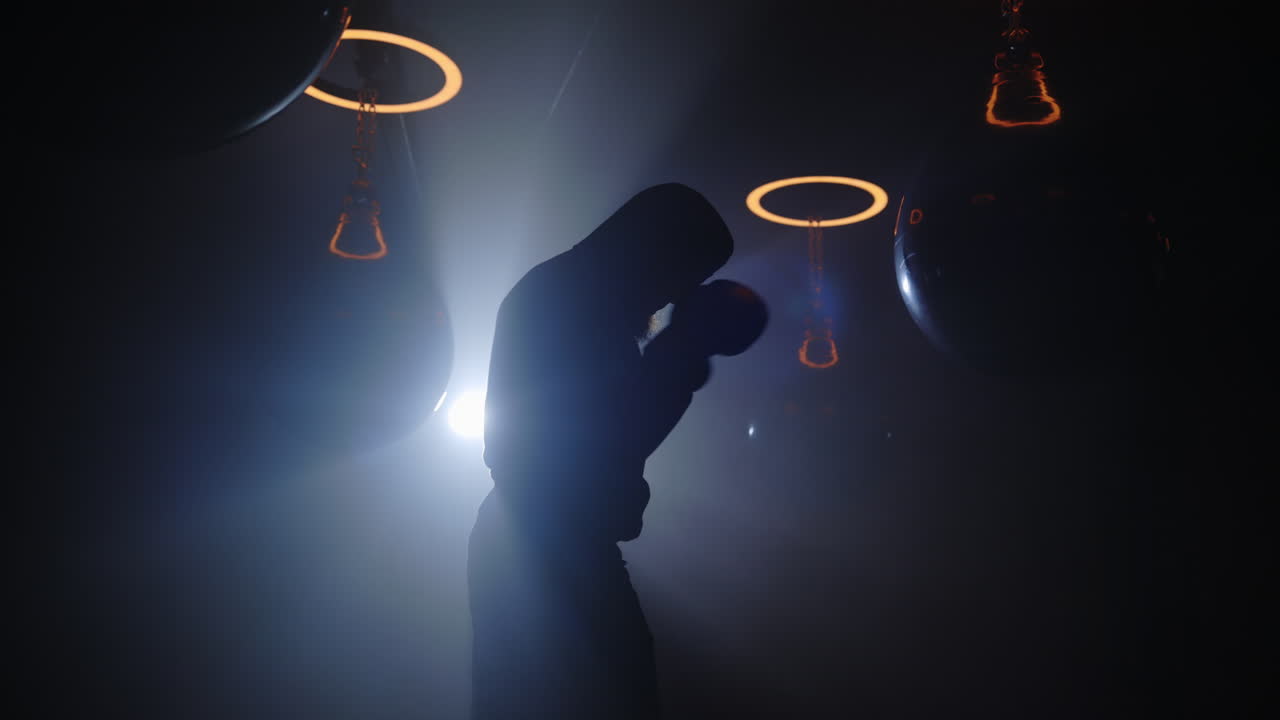 Silhouette of a Boxer Training
