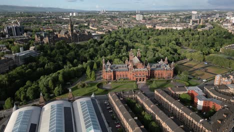 aerial orbit reveal of glasgow university with kelvingrove art gallery and museum grounds, glasgow, scotland, uk