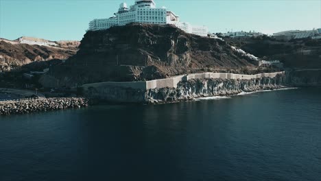 A-drone-revealing-a-hotel-placed-on-the-side-of-a-mountain