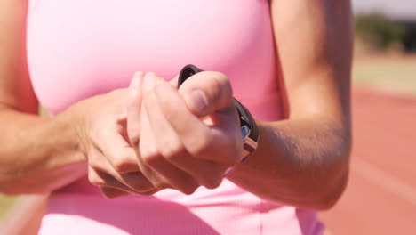 sportswoman wearing smartwatch