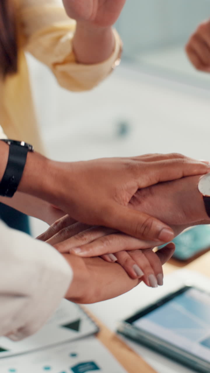 Diverse Business Team Stacking Hands in a Gesture of Unity