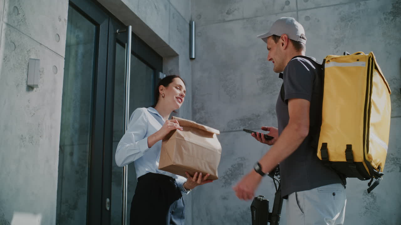 A Customer Receiving Food Delivery at Her Doorstep