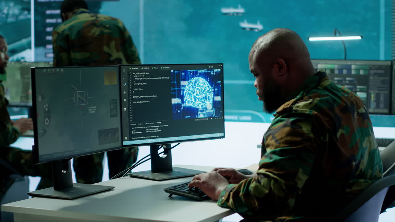 IT professional operating laptop to gather important information from cctv