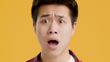surprised asian man