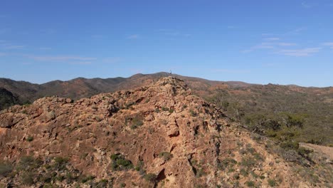 hiker on top rock formation, flinders ranges national park, freedom concept