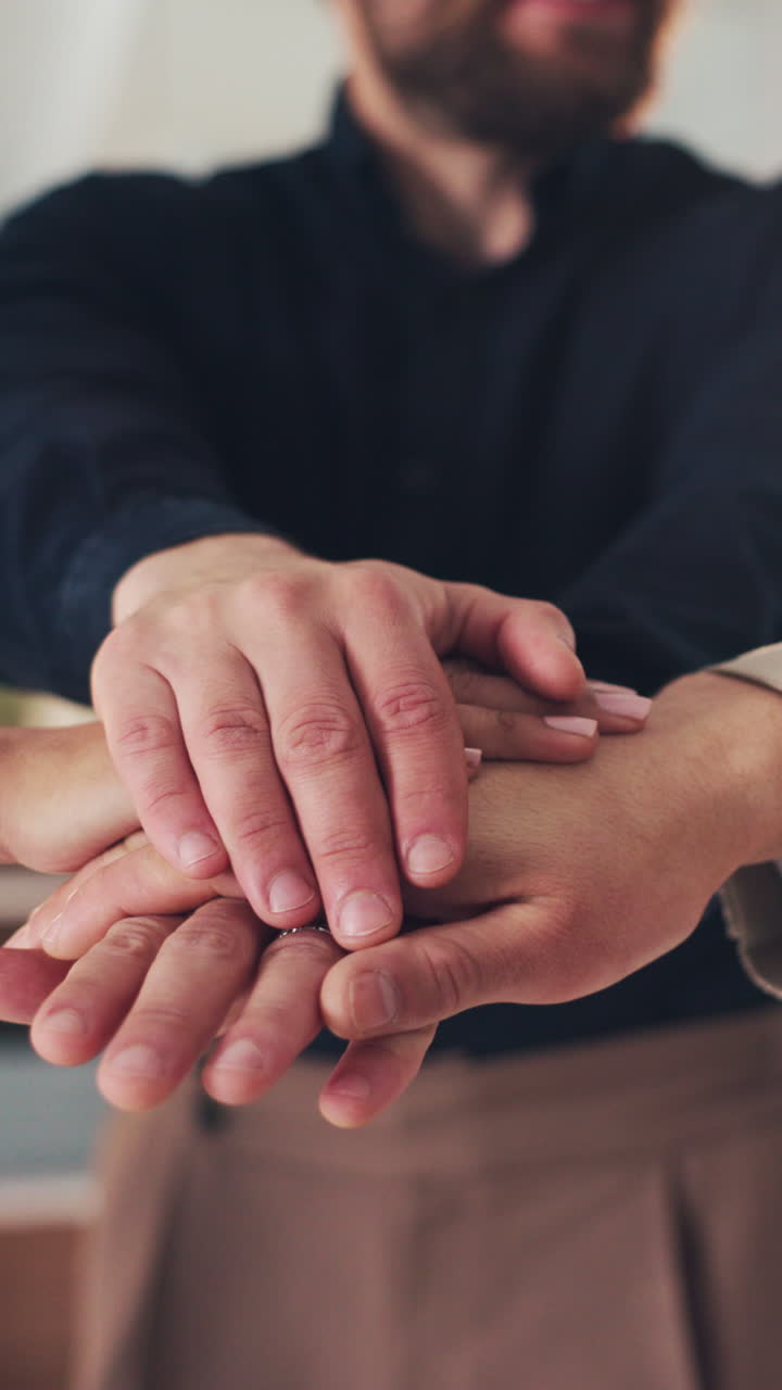 Business Team Stacking Hands and Clapping Together