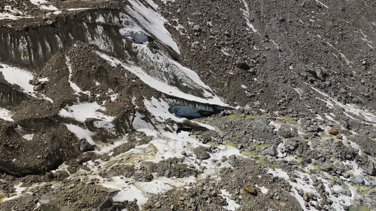 Rugged terrain and caves formed by glacial erosion, Morteratsch, Switzerland aerial