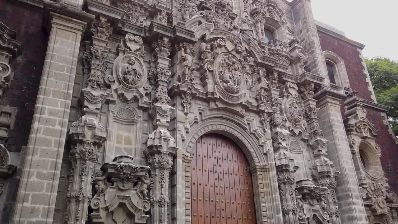 Downward shot capturing the details of the Baroque facade of the Miguel Lerdo de Tejada Library in the historic center of Mexico City