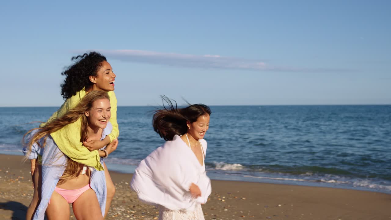 Three friends having fun on the beach