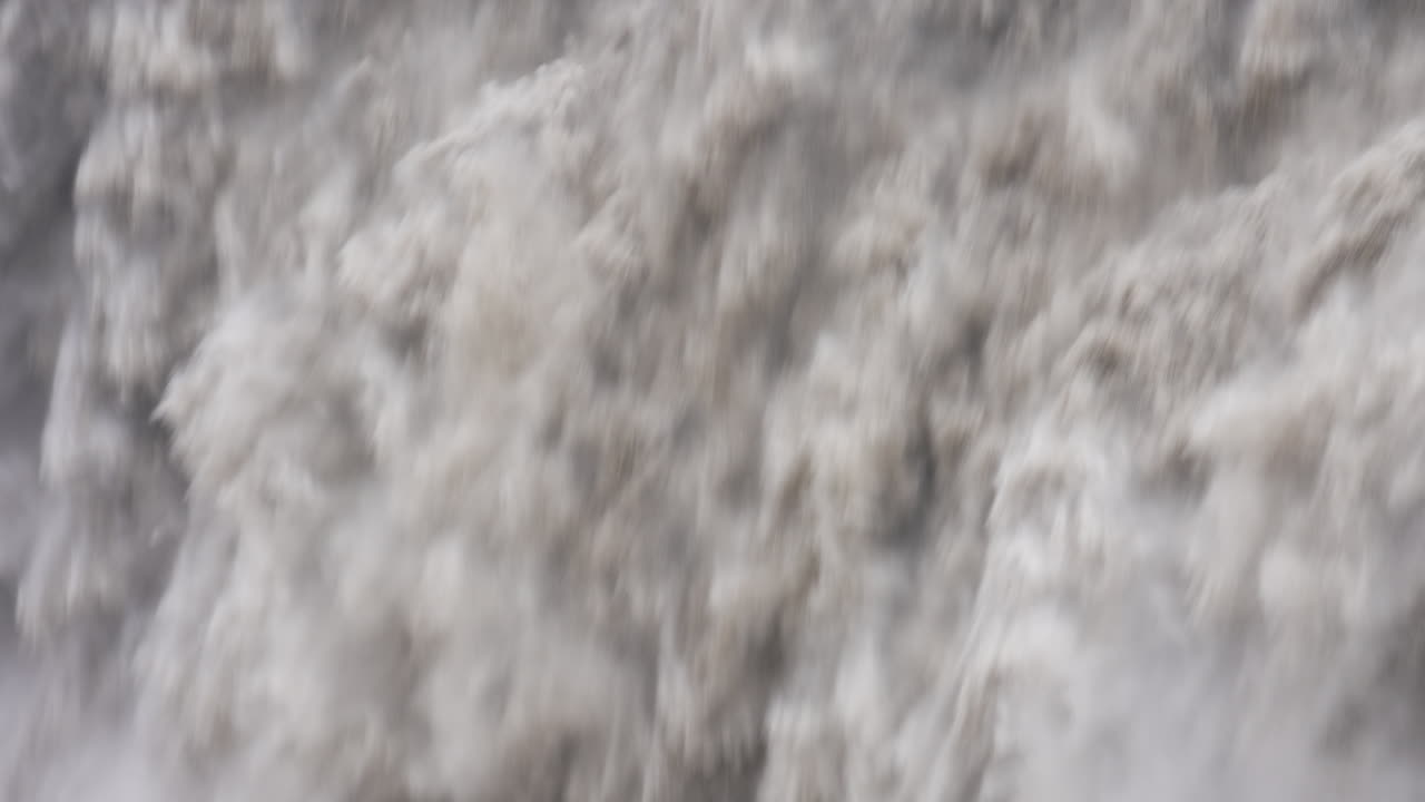 Slow motion close up of floating powerful Dettifoss Waterfall in Iceland