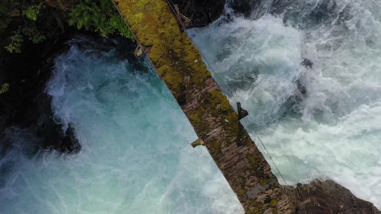 Suspension bridge over the mountain river, Norway.